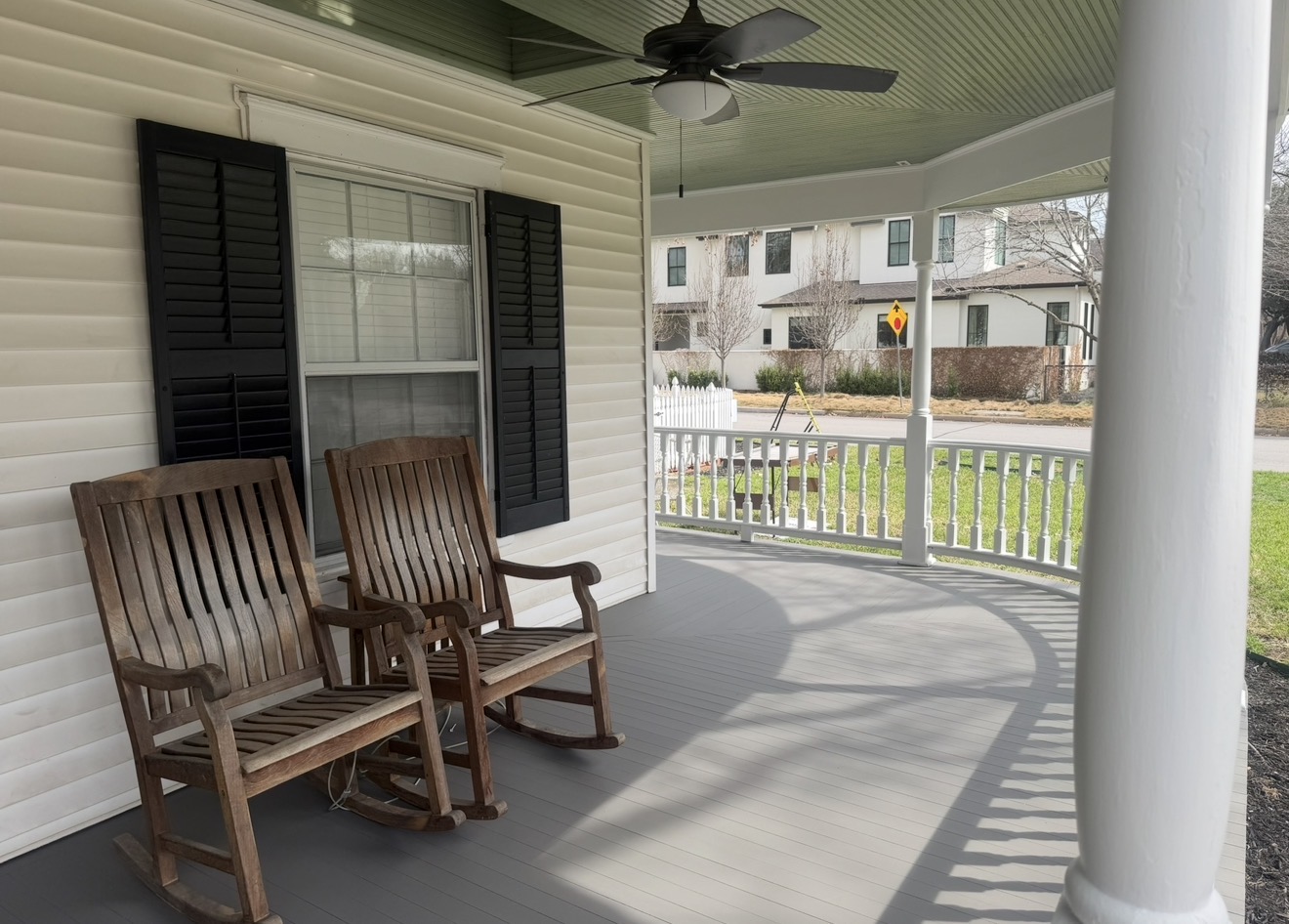 Restored covered front porch with painted floor and trim